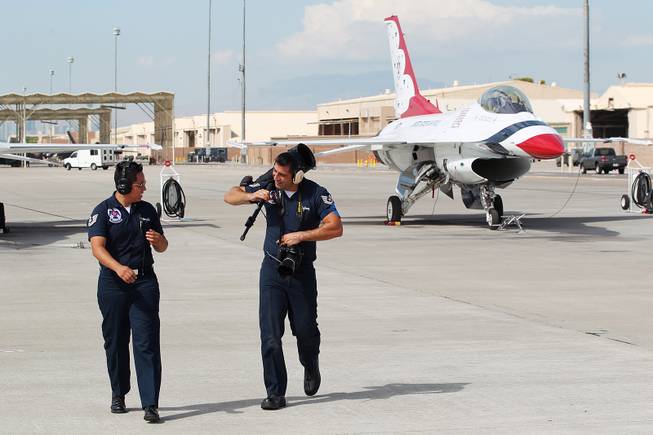 TSgt. Alicia Valenzuela, left, and TSgt. Manuel Martinez talk on the flight line as the Thunderbirds resume limited flight operations at Nellis Air Force Base Tuesday, July 22, 2013 after having to stand down since April because of sequestration.