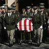 The body of officer Trenton Nettleton is carried out of St. Elizabeth Anne Seton Church after funeral services, November 25, 2009. 