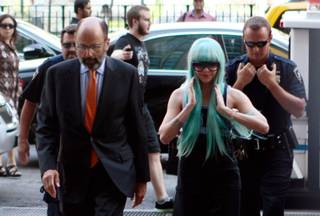 Amanda Bynes, accompanied by attorney Gerald Shargel, arrives for a court appearance in New York, Tuesday, July 9, 2013.  