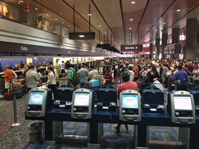 A computer problem caused long lines at ticket counters at McCarran International Airport in Las Vegas on Thursday, July 25, 2013.