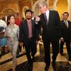 Manny Pacquiao, center, and his wife Jinkee are greeted by Edward Tracy, president and CEO of Sands China, as they arrive at Venetian Macao in Macau, China, on Friday, July 26, 2013. 