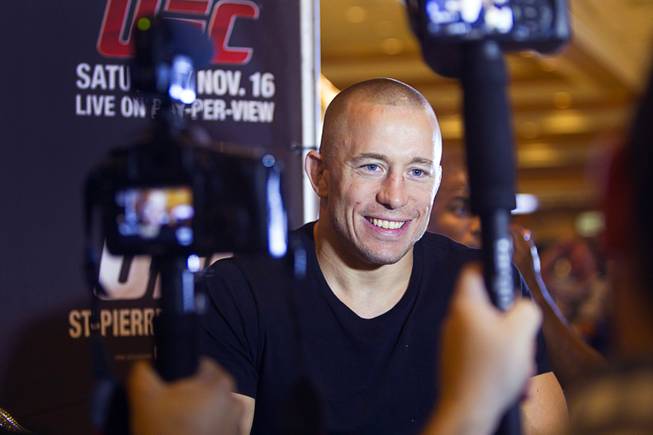 UFC welterweight champion Georges St. Pierre of Canada listens to a question from a reporter during a UFC news conference in the lobby of the MGM Grand Monday, July 29, 2013. St. Pierre will defend his welterweight title against Johny Hendricks of Dallas, Texas during UFC 167 on Nov. 17 at the MGM Grand.