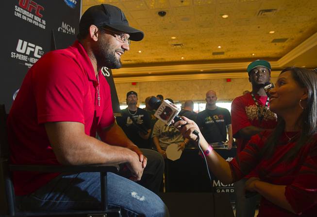 UFC fighter Johny Hendricks of Dallas, Texas talks with reporters during a UFC news conference in the lobby of the MGM Grand Monday, July 29, 2013.Hendricks will challenge UFC welterweight champion Georges St. Pierre of Canada for the title during UFC 167 on Nov. 17 at the MGM Grand.