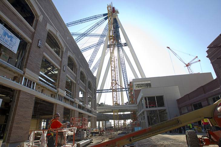 The 550-foot-tall High Roller observation wheel is shown under construction during a tour of Caesars Entertainment's Linq development Tuesday, July 29, 2013. The first phase of the $550 million shopping, dining and entertainment district is expected to open in late 2013. The High Roller is expected to open in 2014.