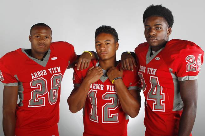 Arbor View High football players (from left) Jacob Speaks, Devon Turner and Anthony Smith before the 2013 season.