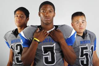 Basic High football players (from left) Pale Laulu, Antraye Johnson and Steven Lalli before the 2013 season.