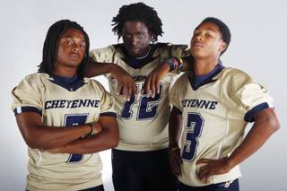 Cheyenne High football players (from left) Martel Evans, Terry Dodd and Deonte Perkins before the 2013 season.