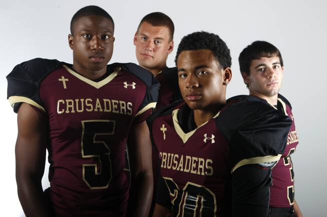 Faith Lutheran football players, from left, Danny Otuwa, Hayden Solis, Keenan Smith and Vinny DeGeorge July 30, 2013.