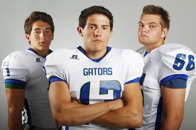 Green Valley High football players (from left) Christian Lopez, Kyler Chavez and Preston Quirt before the 2013 season.