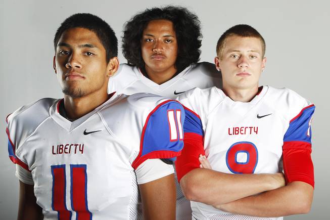 Liberty High football players (from left) Samson Monterde, Jozef Misaalefua and Tyler Newman before the 2013 season.