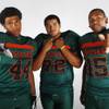 Mojave High football players (from left) Latrell Fleming, Efrain Iglesias and Asante' Lee before the 2013 season.