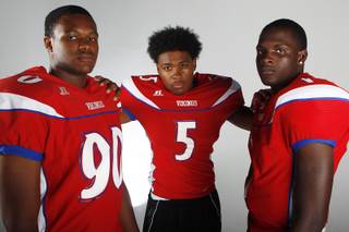 Valley High football players (from left) Noble Hall, Demarrius Oliver and Tyrone Prewitt before the 2013 season.