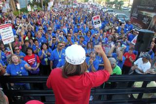 Cosmopolitan housekeeper Janet Nunez speaks as the California School Employees Association, in town for a convention, join Culinary workers to picket the Cosmopolitan Wednesday, July 31, 2013.