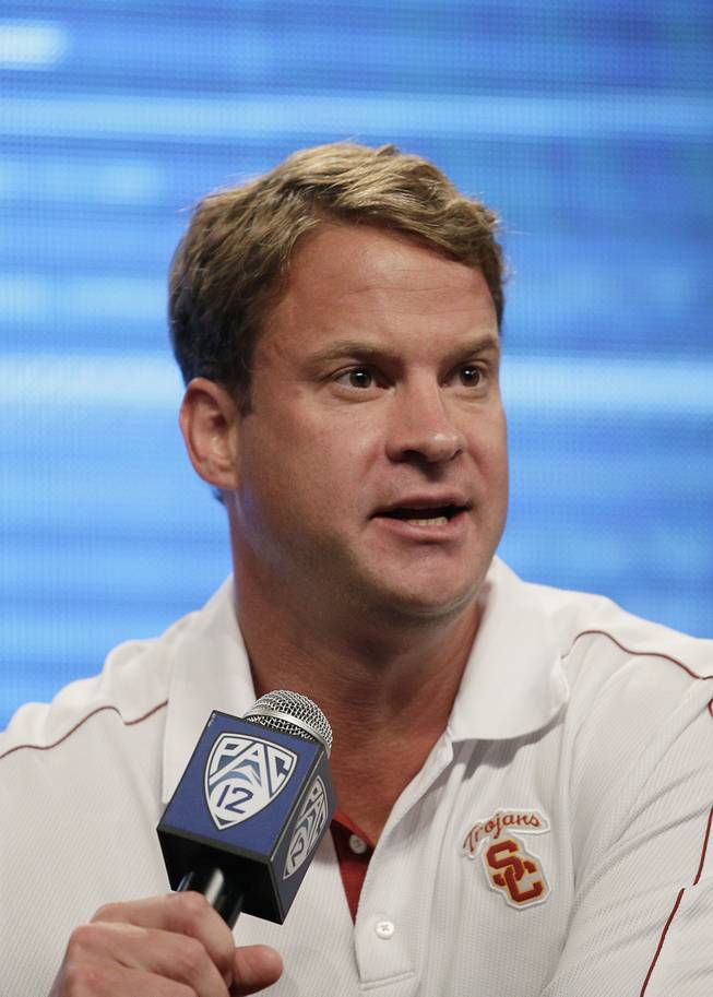 Southern California head coach Lane Kiffin talks to the media during the NCAA college football Pac-12 Media Day on Friday, July 26, 2013, in Culver City, Calif.