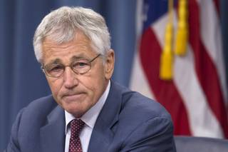 Defense Secretary Chuck Hagel pauses during a news conference at the Pentagon, Wednesday, July 31, 2013. 