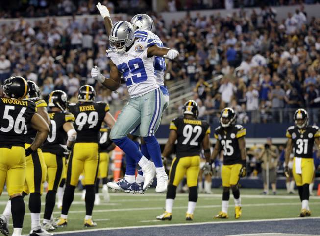 Dallas Cowboys running back DeMarco Murray (29) celebrates his touchdown against the Pittsburgh Steelers with Dez Bryant (88) during the second half of an NFL football game Sunday, Dec. 16, 2012 in Arlington, Texas. 
