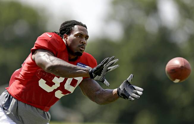 Atlanta Falcons' Steven Jackson catches a pass during NFL football training camp at the team's practice facility, Thursday, Aug. 1, 2013, in Flowery Branch, Ga. 