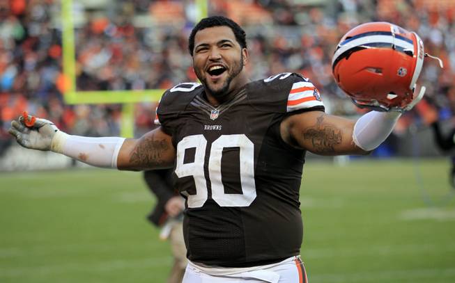 Cleveland Browns defensive lineman Billy Winn celebrates after the Browns won 20-14 in an NFL football game against the Pittsburgh Steelers Sunday, Nov. 25, 2012, in Cleveland. 