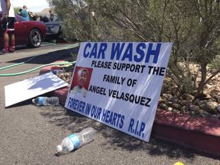 Metro Explorers hold a car wash fundraiser Saturday, Aug. 3, 2013, at Brake Masters on South Eastern Avenue to help with funeral expenses for Angel Velasquez's family.