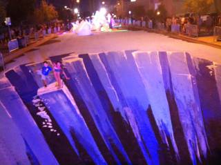 A blocklong section of Casino Center Boulevard has been transformed into an ice-themed 3-D street mural for First Friday on Aug. 2, 2013.
