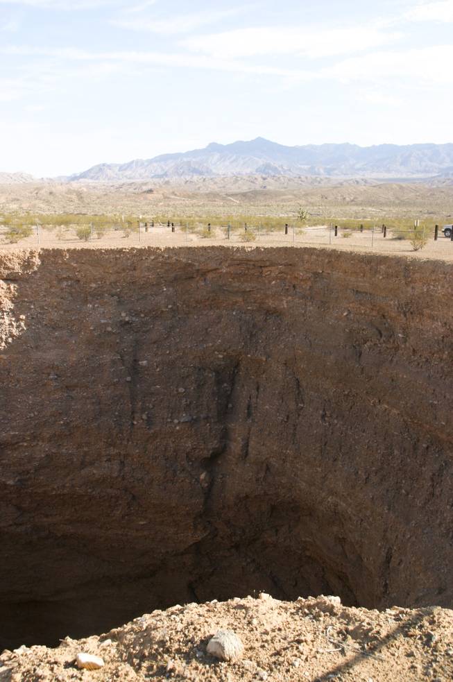Devils Throat, a 100-foot sinkhole in the middle of the desert, is a geologic oddity within Gold Butte, Aug. 4, 2013.