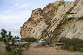 A campsite is seen in the Whitney Pockets area of Gold Butte, Aug. 4, 2013. Sandstone rock formations and Joshua trees protect primitive campsites.