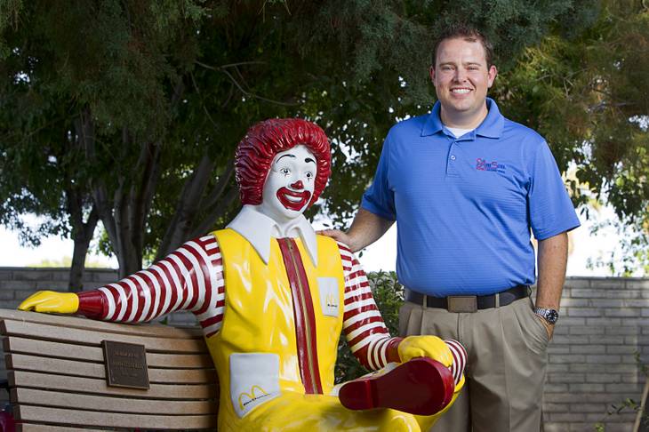 Jeremy Anderson, general manager of Aire Serv, poses by a statue of Ronald McDonald at the Ronald McDonald House Monday, Aug. 5 2013. The The Ronald McDonald House provides temporary housing for families who travel to Las Vegas to receive critical medical treatment for their children.