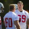 Brett Boyko (69), right, talks with teammates during practice at UNLV Tuesday, Aug. 6, 2013.