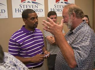 Mesquite resident John Williams, right, discusses the proposed Gold Butte National Conservation area with Nevada 4th District Congressman Steven Horsford on Friday at Horsford's campaign headquarters in North Las Vegas after Horsford announced his intention to run for re-election in 2014 to a gathering of constituents and supporters.