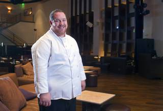 Chef Doug Bell poses in the Heraea restaurant in the Palms Monday, Aug. 12, 2013.