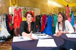 Kristy Rivers and Briana Haft, of Dore Exquisite Gowns, talk about the start-to-finish process behind their companies' extravagant ballroom gowns, Thursday Aug. 16, 2013. Dore's exquisite gowns are on display at the 2013 Nevada Star Ball dance championship at Green Valley Ranch Resort, Spa & Casino.