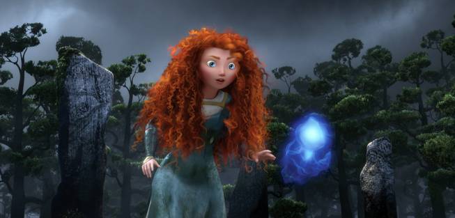 In this undated publicity film image released by Disney/Pixar, the character Merida, voiced by Kelly Macdonald, follows a Wisp in a scene from "Brave."  