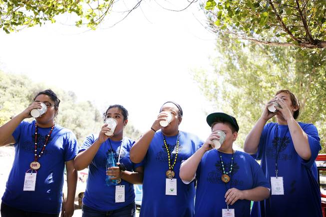 Campers participate in a water drinking contest at Camp Heart and Sole at Torino Ranch in Lovell Canyon on Saturday, August 17, 2013.