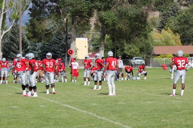 The Rebels defense waits around for the next play at a scrimmage on Saturday, August 17, 2013, in Ely.