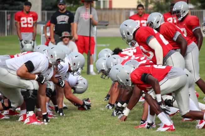 The Rebels' defensive front awaits the offensive snap during a scrimmage on Saturday, August 17, 2013, in Ely.