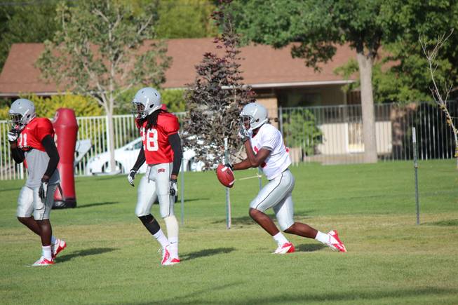 UNLV freshman Kendal Keys runs back to his teammates to after catching a touchdown during scrimmage on Saturday, August 17, 2013, in Ely.