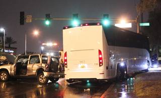 A five car accident, including a tour bus, is seen on Oneida Way and Desert Inn during a rainy evening, Sunday, Aug. 19, 2013.