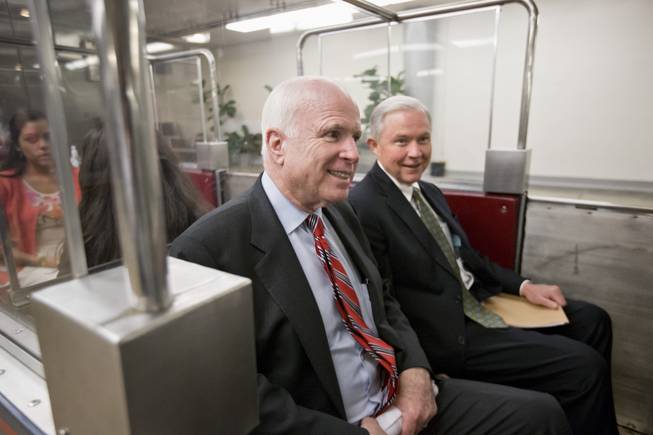 Sen. John McCain, R-Ariz., left, and Sen. Jeff Sessions, R-Ala., members of the Senate Armed Services Committee, return to their offices after votes Thursday, July 25, 2013, on Capitol Hill in Washington. The Obama administration is telling lawmakers that it won't declare Egypt's government overthrow a coup, U.S. officials said, allowing the U.S. to continue providing $1.5 billion in annual military and economic aid to the Arab world's most populous country, against the wishes of McCain and others. 
