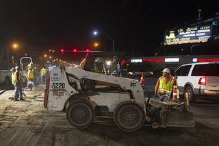 Harber Company employees work on a repaving project on Decatur Blvd. near Flamingo Road Thursday, Aug. 22, 2013.