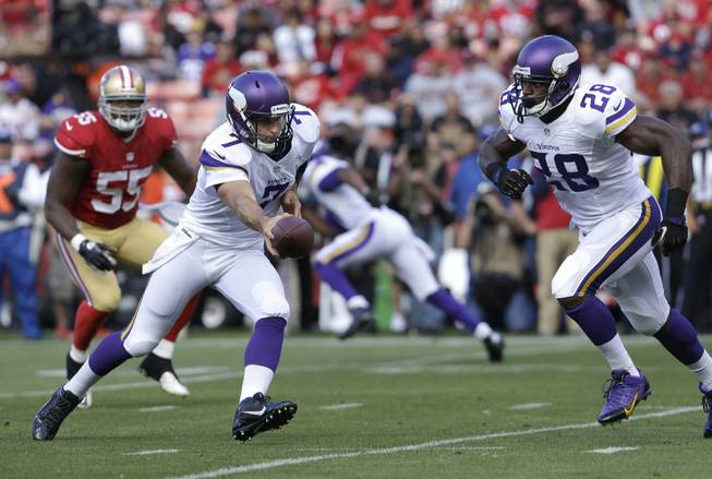 Minnesota Vikings quarterback Christian Ponder (7) play fakes a hand off to running back Adrian Peterson (28) during the first quarter of an NFL preseason football game against the San Francisco 49ers in San Francisco, Sunday, Aug. 25, 2013. 