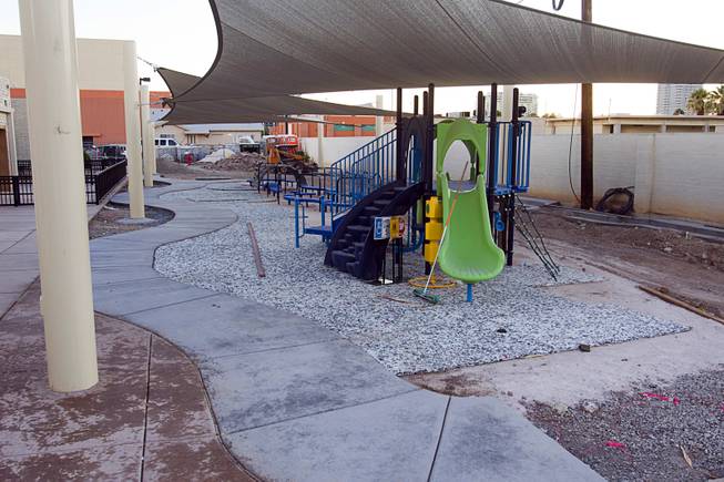 A playground, still under construction, for preschool and kindergartens students is shown during a grand opening ceremony for the 9th Bridge School in downtown Las Vegas Tuesday, Aug. 27, 2013. The private school/early childhood learning center, part of the Downtown Project, opened August 26 with infants through kindergarten students and will gradually add grades.