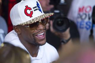 Undefeated boxer Floyd Mayweather Jr. talks with reporters at the Mayweather Boxing Club Wednesday, August 28, 2013. Mayweather will face Canelo Alvarez of Mexico in a WBC/WBA 154-pound title fight at the MGM Grand Garden Arena on September 14.