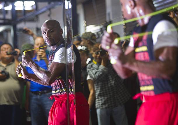 Undefeated boxer Floyd Mayweather Jr. watches his reflection in a mirror as he works out at the Mayweather Boxing Club Wednesday, August 28, 2013. Mayweather will face Canelo Alvarez of Mexico in a WBC/WBA 154-pound title fight at the MGM Grand Garden Arena on September 14.
