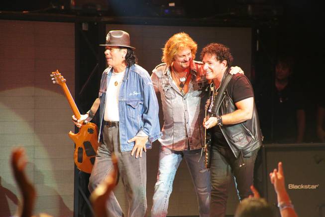 Carlos Santana and Gregg Rolie join Neal Schon onstage during Journey's concert at Pearl at the Palms on Wednesday, Aug. 28, 2013.

