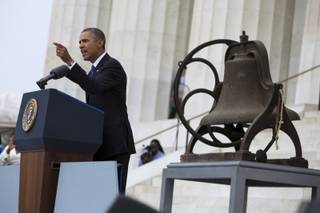 President Barack Obama gestures while speaking at a ceremony commemorating the 50th anniversary of the March on Washington, Wednesday, Aug. 28,2013, at the Lincoln Memorial in Washington. 