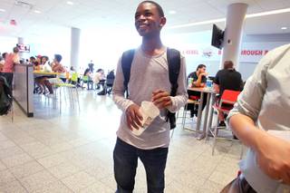 Ke'Andre Blackston Jr., a 14-year-old freshman at UNLV, waits for a lunch order in the student union.
