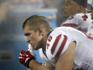 UNLV players Jake Phillips (46) and Tim Cornett are dejected during the fourth quarter against Minnesota during an NCAA college football game in Minneapolis, Thursday Aug. 29, 2013. Minnesota defeated UNLV 51-23. (AP Photo/Andy Clayton-King)