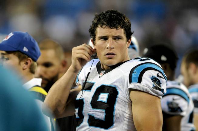 Carolina Panthers middle linebacker Luke Kuechly (59) listens to defensive calls on a radio during an NFL preseason football game against the Pittsburgh Steelers in Charlotte, NC, Thursday, Aug. 29, 2013.