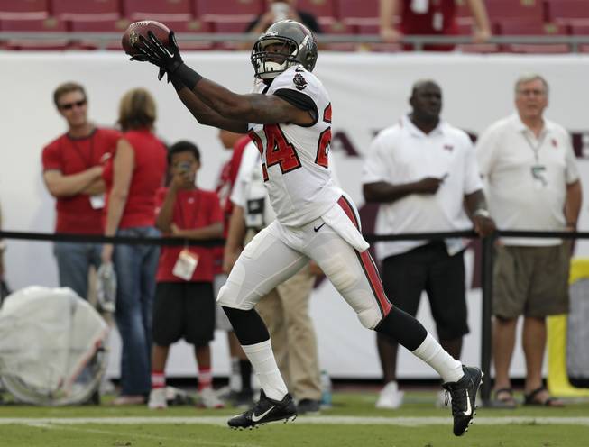 Tampa Bay Buccaneers cornerback Darrelle Revis catches a pass before an NFL preseason football game against the Washington Redskins Thursday, Aug. 29, 2013, in Tampa, Fla. 