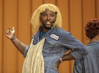 In this Aug. 27, 2013, photo, rapper Postell Pringle wears a wig as he performs in a hip hop adaptation of William Shakespeare's Othello, titled 